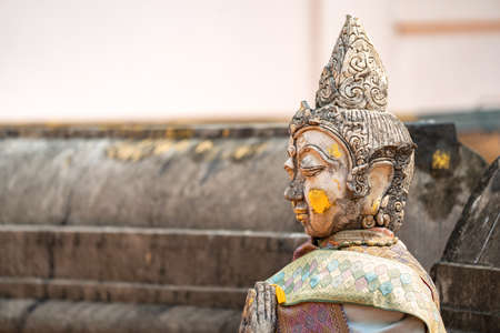 Vintage Stone Traditional Statue in Woman Character at backside of Wat Phra That Chom Kitti, a...