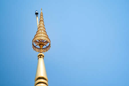 CHAT, gold tiered at the top of Wat Phra That Chom Kitti, contains a fragment of the Buddha relic that was split divided amongst this site, Chiang Rai, Thailand.の写真素材