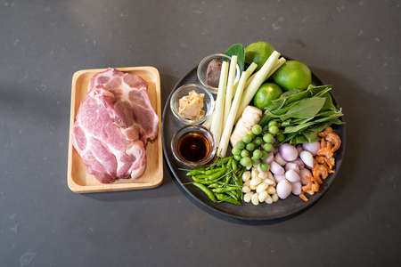 topview flatlay of Raw Pork and herb ingredients, preparation for Cooking in Thai food menu. Clipping Paths.の写真素材
