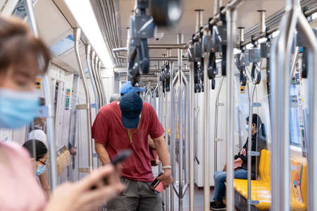 The Environment of Asia passengers inside the Sky Train with the masks on all people's faces.のeditorial素材