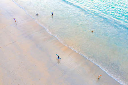 top view flatlay aerial of Phuket Province Thailand with Copy Space zone on stunning beautiful turquoise sea landscape and surfman traveler on the beach.の写真素材