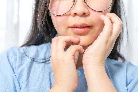 Half face below of Asian woman with smooth face skin and sexy lip.