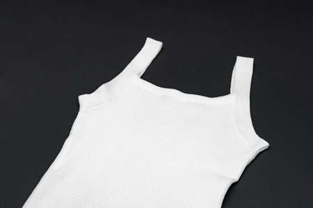 flat White knitwear vest shape on black background with studio lightの写真素材