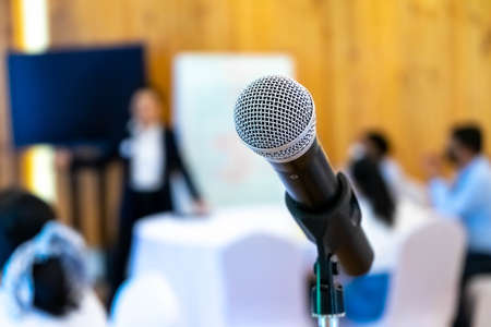 microphone is on microphone stand in seminar meeting room for everyone to use when speaking or...