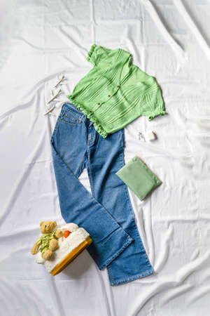 Pairing with a green crop top and small pocket jeans. It's a great outfit for a trip and also works well for clothing advertising on social media.の写真素材