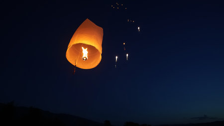 Release the traditional paper lanterns into the sky during the night of the festival in Thailand.の写真素材