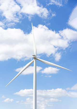 Wind turbines in the blue sky on a sunny day, produced electricity from pure energy.