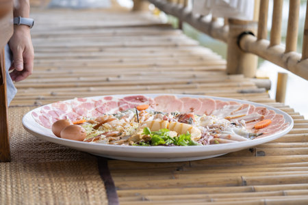 Huge Shabu is a dish made of raw pork and chicken meat, tofu, and a few vegetables. blanch in a pot of hot water.の写真素材