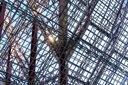 Uprisen angle photo shot of the huge steel roof frame structure detail under construction at the...