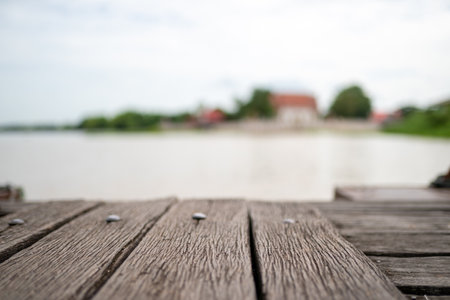 close up vintage old wood plate at pier with river background.の写真素材
