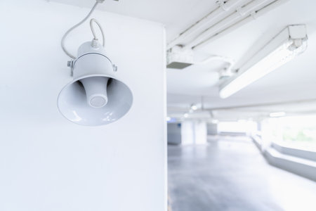 A Megaphone speaker is set up on the pole ceilling in car parking area.の写真素材