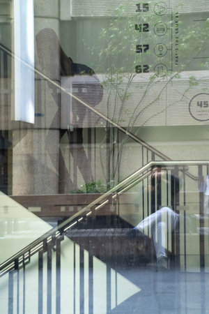 A contemporary glass structure refracts the energy of urban surroundings, blending architecture and...
