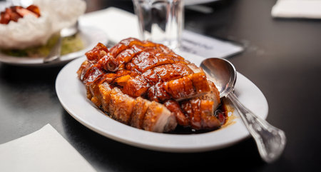 crispy pork and roasted duck is served with a caramelized glaze, embodying authentic Chinese barbecue flavors.の写真素材