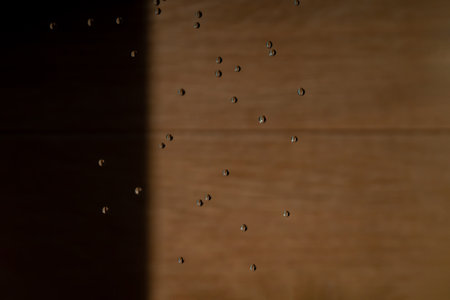 Abstract backgrond dropped water stop motion and dripping to the ground from Shower on blur orange brown background at outdoor light.の写真素材