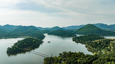 Kaeng Krachan dam with lake view and many green moutain, blue sky background. Kaeng Krachan Dam national park, Phetchaburi province, Thailand in aerial view from drone.の写真素材
