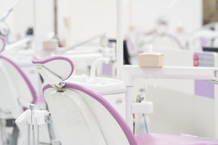 Many modern dental equipment and seats in a hygiene and sterile dental training room in the hospital.の写真素材