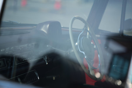 steering; craftsmanship; wheel; vintage; car; chrome; quality; leather; classic; retro; design; dashboard; automobile; control; detail; metal; handmade; circle; engineering; driving; restored; luxury; elegant; curved; old; style; mechanic; handle; round; heritage; interior; texture; gear; grip; symmetry; antique; function; black; reflection; authentic; trim; original; sunlight; smooth; transportation; clean; manual; classiccar; historicの写真素材