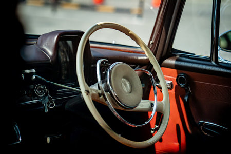 steering; craftsmanship; wheel; vintage; car; chrome; quality; leather; classic; retro; design; dashboard; automobile; control; detail; metal; handmade; circle; engineering; driving; restored; luxury; elegant; curved; old; style; mechanic; handle; round; heritage; interior; texture; gear; grip; symmetry; antique; function; black; reflection; authentic; trim; original; sunlight; smooth; transportation; clean; manual; classiccar; historicの写真素材