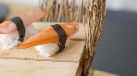 Crab sushi, traditional Japanese food style. Sliced crab stick on rice display for photo shooting.の写真素材