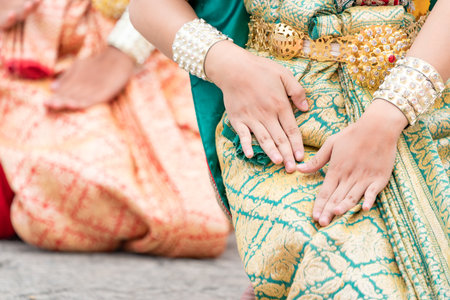 Close up hand of Thai folk dance during celebration on temple background. Thai traditional dance on event celebration.の写真素材