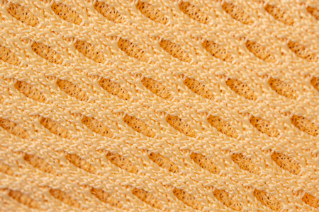 Breathable yellow design showcases the innovation of airflow and comfort in engineered fabric,...
