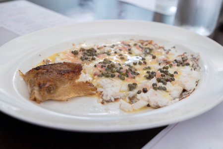 Pan cooked white fish served with capers and butter sauce in a classic European restaurant style...