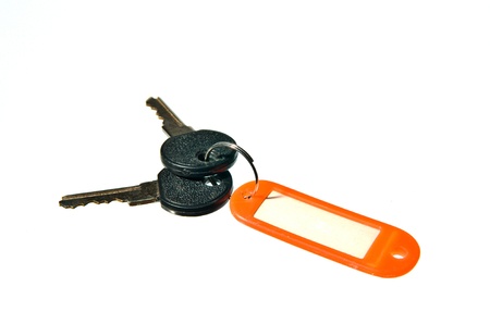 old key attached to a plastic keychainの写真素材
