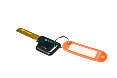 old key attached to a plastic keychainの写真素材
