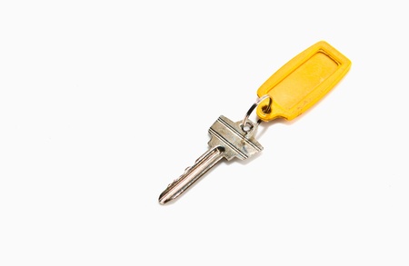 old key attached to a plastic keychainの写真素材