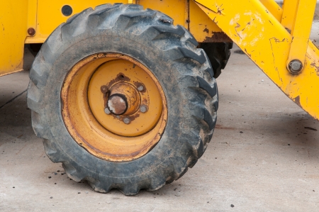 old Wheel of backhoe close upの写真素材