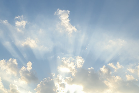 Sun light shining through the cloudsの写真素材