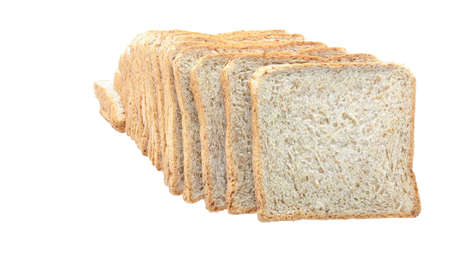 row of whole wheat bread  slices  on white background closeupの写真素材