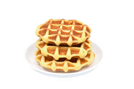 colorful three pieces of waffle  on white dish closeupの写真素材