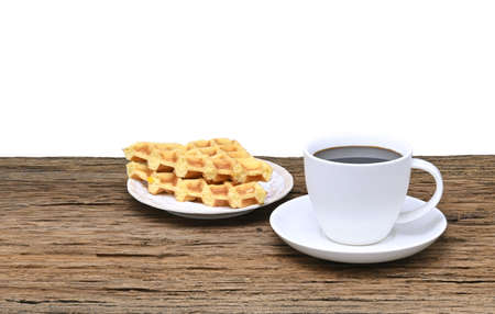 black coffee in white seramic glasses and waffle  on  wooden tableの写真素材