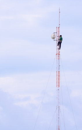engineer work on communication tower