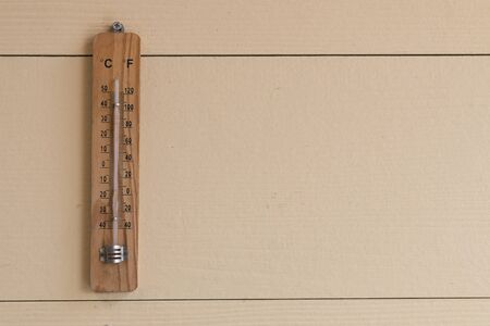 thermometer on wood backgroundの写真素材