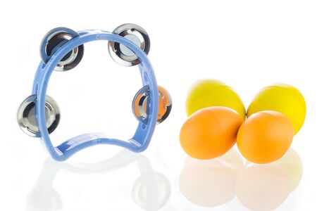 Tambourine and egg maracas shaker on a white background.の写真素材