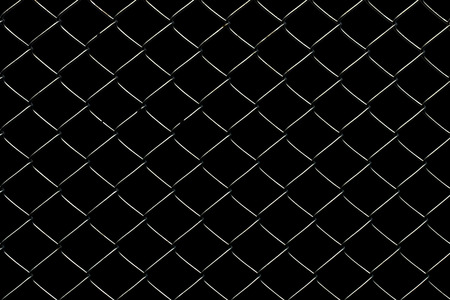 Wired fence on a black background.の写真素材