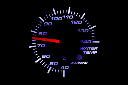 Temperature gauge in car at 76 degrees centigrade.の写真素材