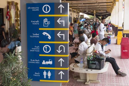 AYUTTHAYA, THAILAND - APRIL 3, 2016 : Passengers waiting for a train to the platform and signs information on April 3, 2016 in Ayutthaya Train Stationのeditorial素材