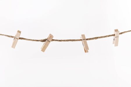 wooden clothespins on a rope