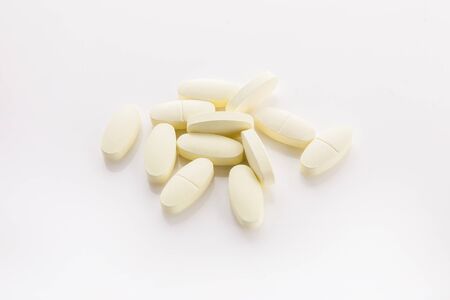 Tablets pills heap color mix therapy drugs doctor flu antibiotic pharmacy medicine medicalの写真素材