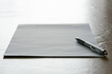 Abstract background of pen and paper with dim lightの写真素材