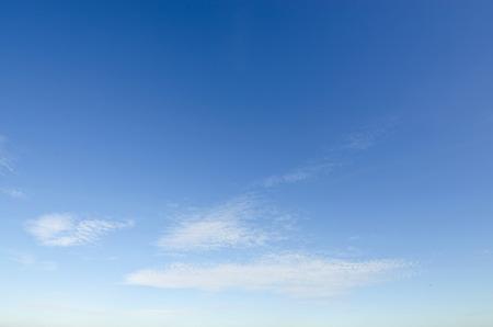 Clear blue sky with white cloud on a summer shiny dayの写真素材
