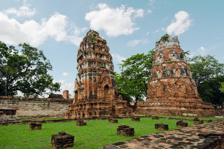 Old buddha pagoda temple with cloudy white sky in Thailandの写真素材