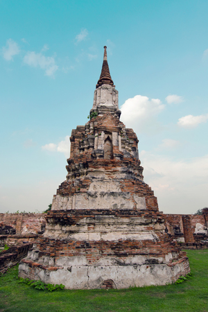 Old buddha pagoda temple with cloudy white sky in Ayuthaya Thailandの写真素材