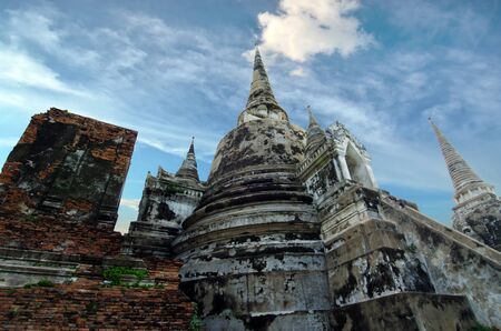 Old buddha pagoda temple with cloudy white sky in Ayuthaya Thailandの写真素材