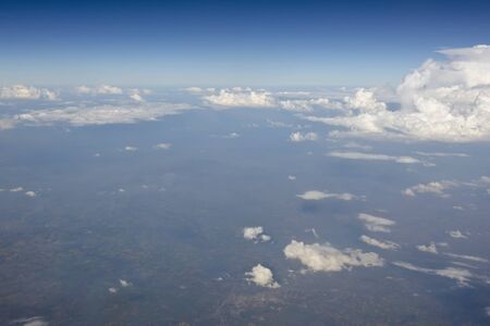 Bird eye view of cloud, mountain and sky in Thailand from airplane window