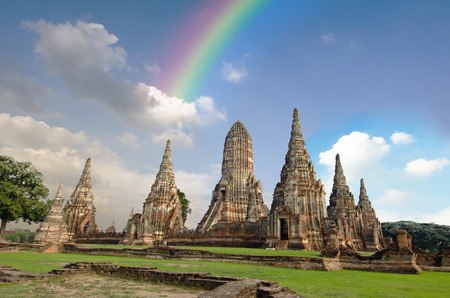 Old buddha pagoda temple with cloudy white sky and rainbow in Ayuthaya Thailandの写真素材