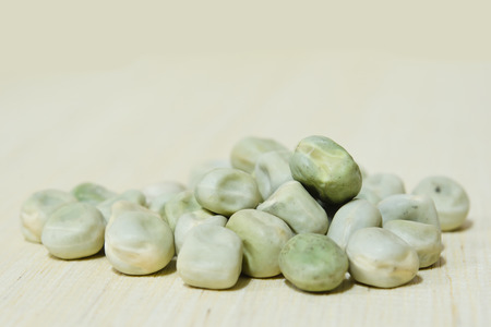 Closeup view of pea over wooden board backgroundの写真素材